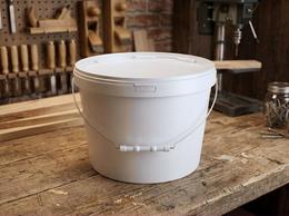 8 liter plastic bucket on a joinery workbench