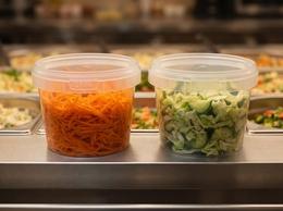 550 ml plastic containers of salad in a ready-meal display case