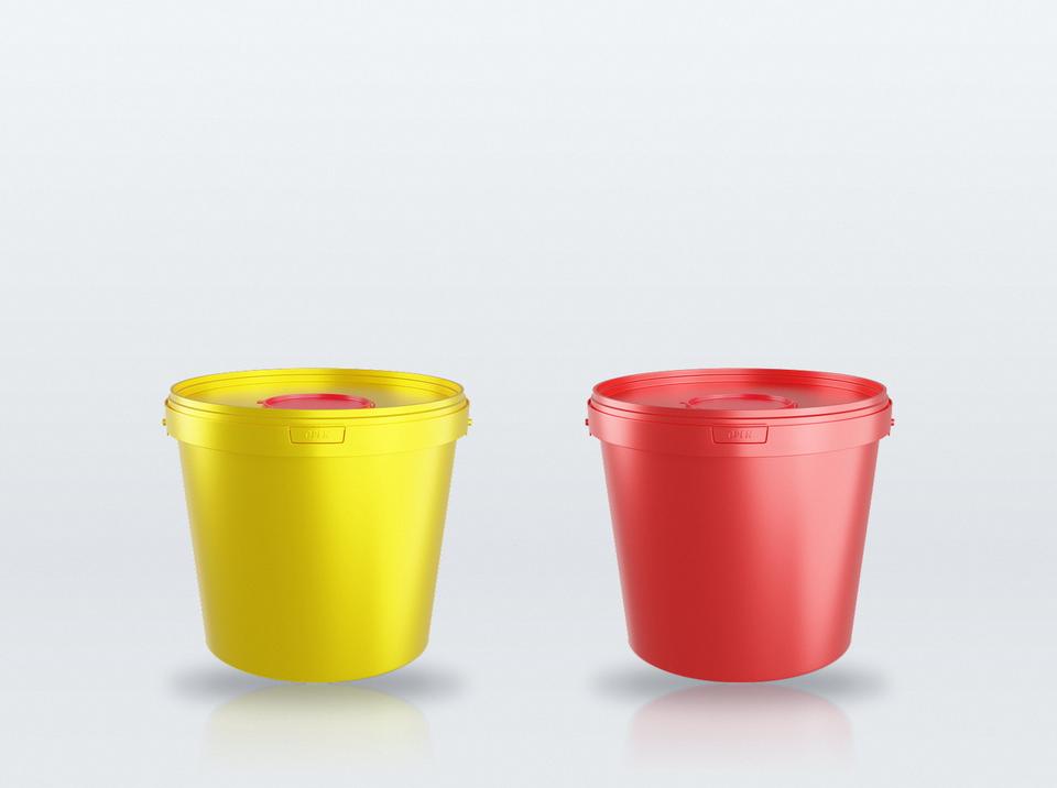 Yellow and red 5.6 liter medical buckets in a treatment room